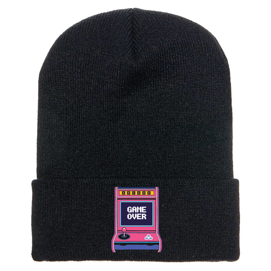 Black cuffed beanie made of acrylic material with a retro arcade game console with the phrase “Game Over” on the screen.