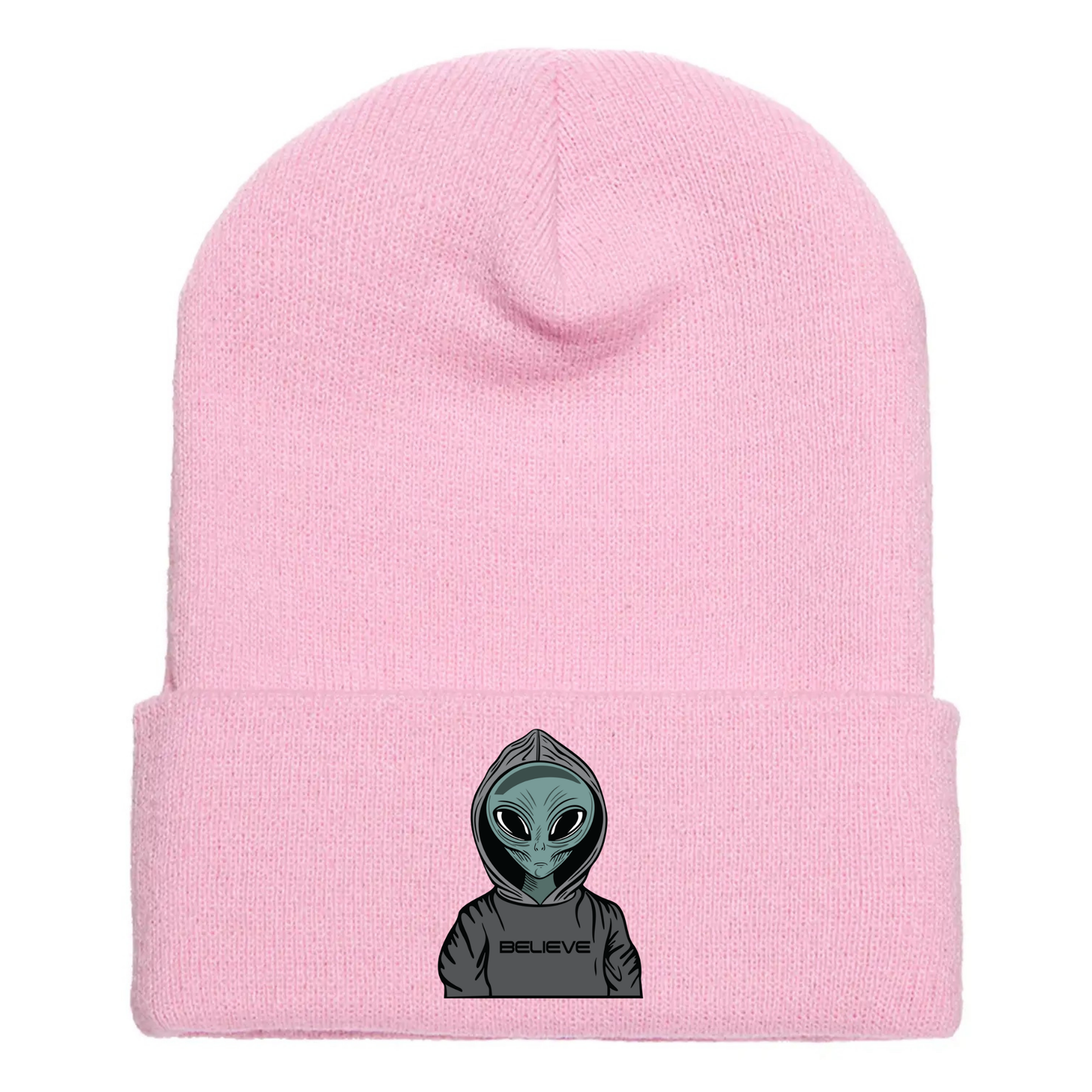 Pink acrylic beanie featuring a serious cartoon alien in a gray hoodie with the word “BELIEVE” printed across the front.