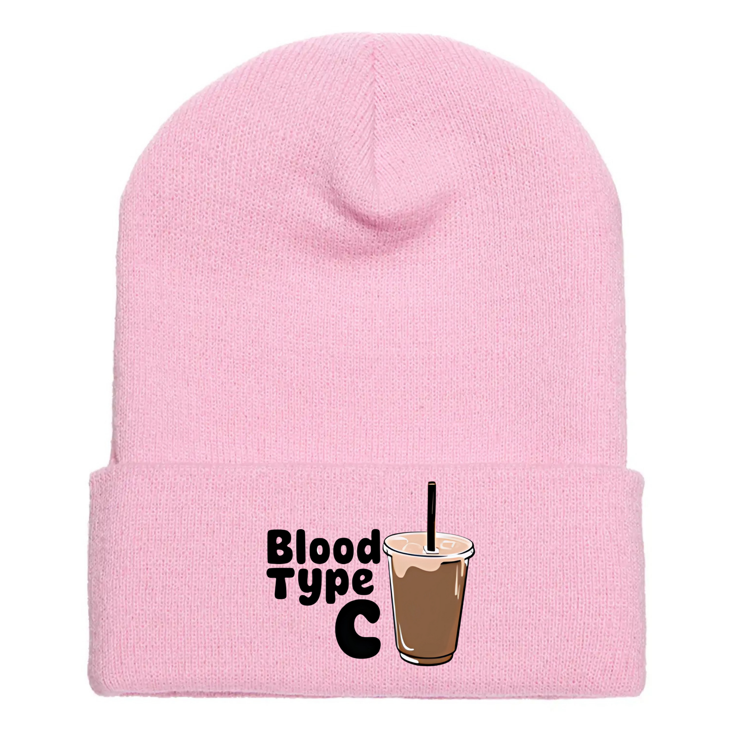 Pink cuffed beanie made of acrylic material with an image of an ice coffee and the phrase “Blood Type C”.