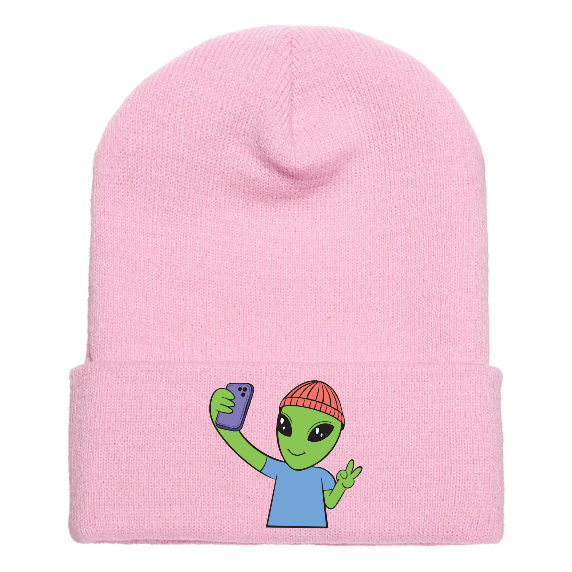 Pink acrylic beanie featuring a cartoon alien in a red beanie taking a selfie and flashing a peace sign with one hand.